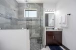 Guest Bathroom with Glass Walk in Shower, Sink and Toilet
